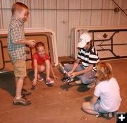 Playing with the robots. Photo by Dawn Ballou, Pinedale Online.