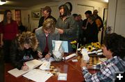 Signing In. Photo by Dawn Ballou, Pinedale Online.