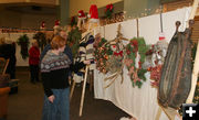 Looking at wreaths. Photo by Dawn Ballou, Pinedale Online.