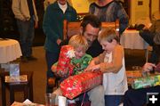 Opening gifts. Photo by Carla Sullivan.