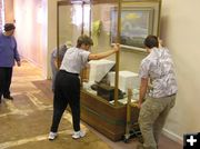 Moving display cases. Photo by Pinedale Online.