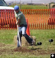 Raking the dirt. Photo by Dawn Ballou, Pinedale Online.