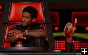 Usher listening. Photo by The Voice on NBC.
