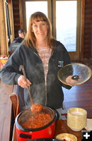 Kim serving chili. Photo by Terry Allen.