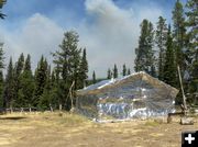 Craig Cabin under fire protection wrap. Photo by Bridger-Teton National Forest.